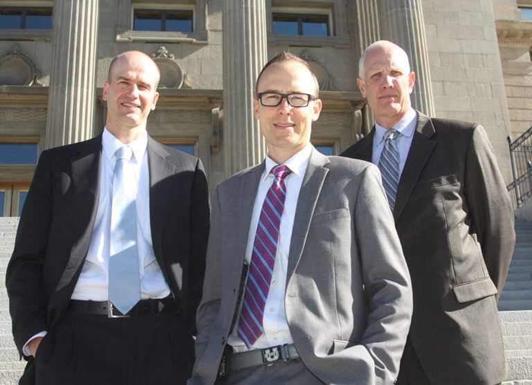 three fbi agents standing on the steps to the Idaho State Capitol Building