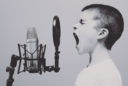 boy yelling into a microphone