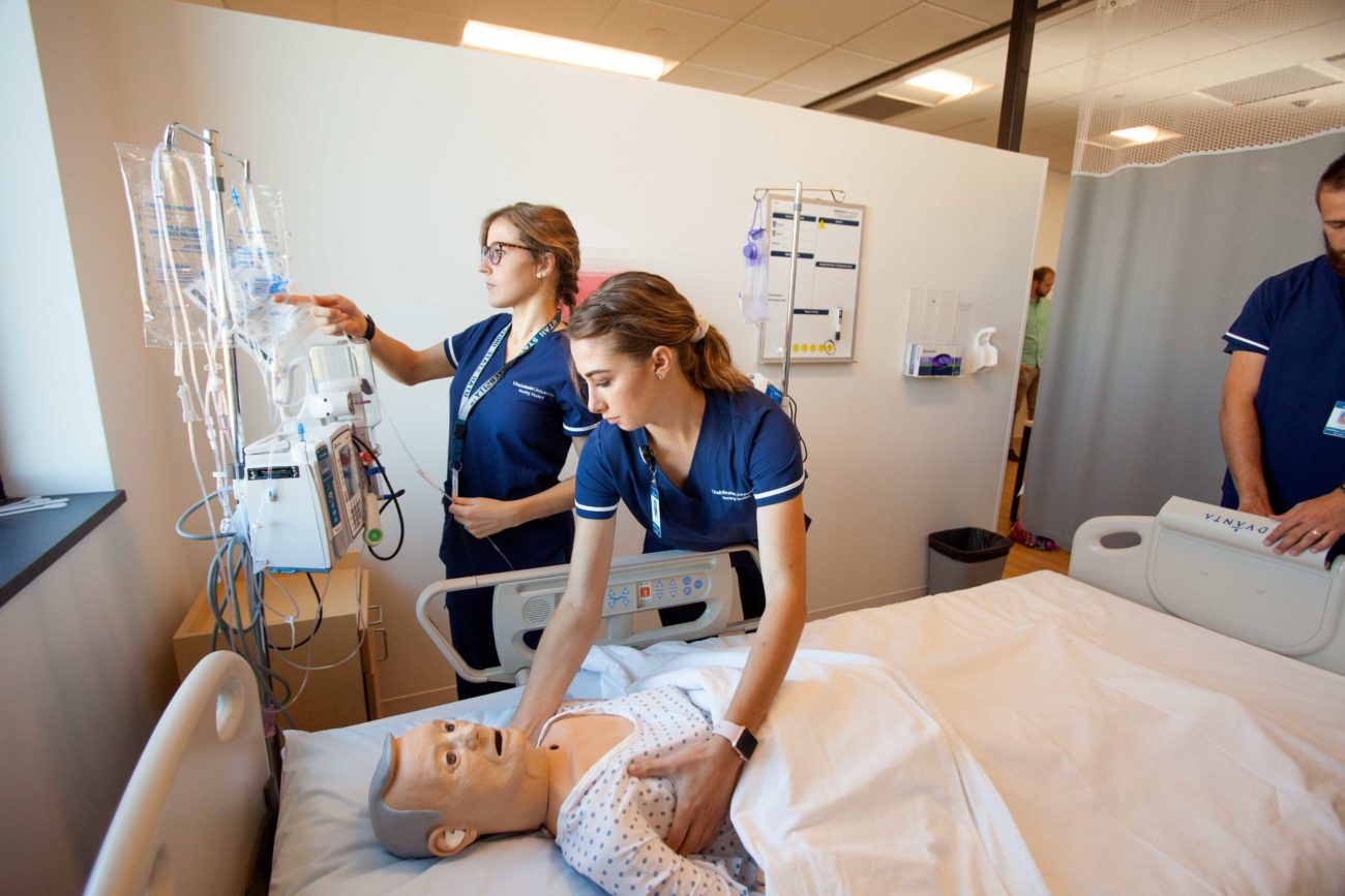 USU nursing students work on a high-fidelity simulation mannequin.