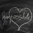 chalkboard with heart on it surrounding the word "possible."