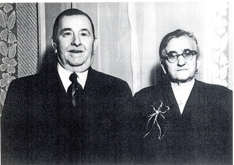 A portrait of the author's Italian grandparents looking straight into the camera.