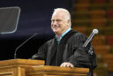 Eric Hipple delivers a talk from the lectern at commencement
