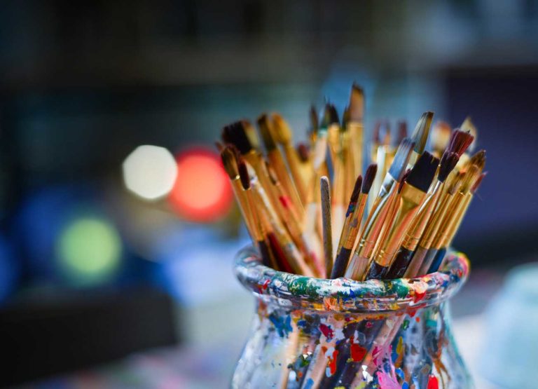 paint brushes in a jar