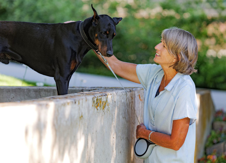 Noelle Cockett looks at her grand dog Duke.