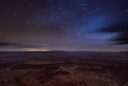 the Milky Way unfolds above a night time desert scene