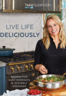 a blonde woman in a kitchen making a salad with title "live life deciously: recipes for busy weekdays and leisurely weekends" by tara teaspoon
