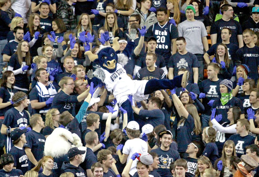Big Blue crowdsurfs at a game at the Spectrum. For some reason, all of the fans are wearing blue rubber gloves.
