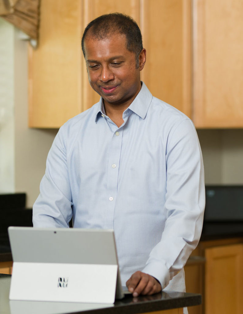 Man looking at a surface laptop