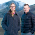 professors jennifer reeve and Matt Yost stand in a field discussing carbon farming