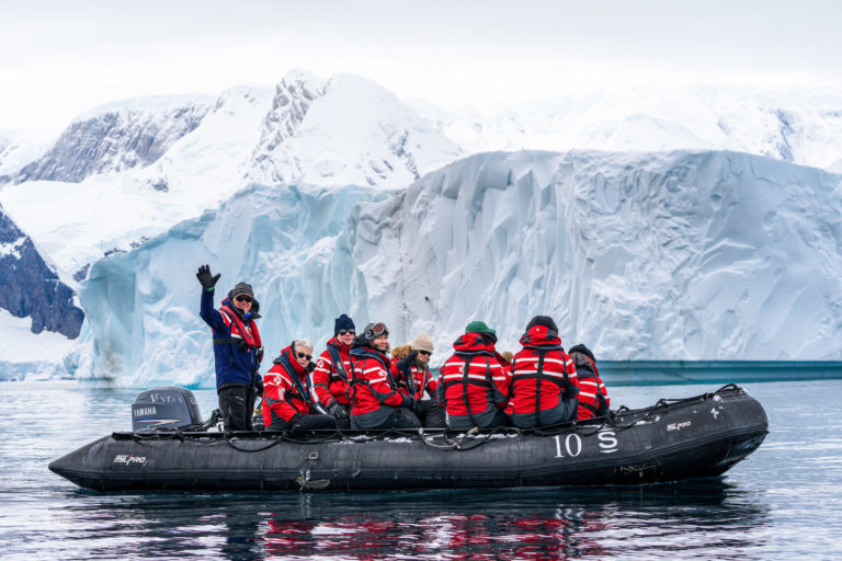 Members of the nonprofit group Walking Softer travel around the Antarctic Peninsula on a Zodiac raft to view scenery and wildlife as part of the inaugural Walking Softer Leadership Summit.