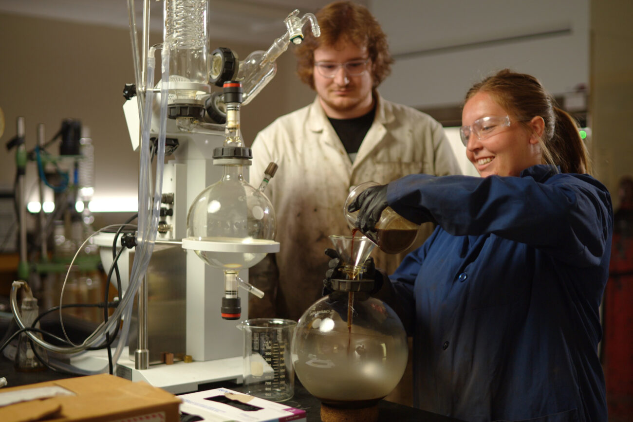 USU researchers work in a lab converting renewable waste byproducts into fuel.