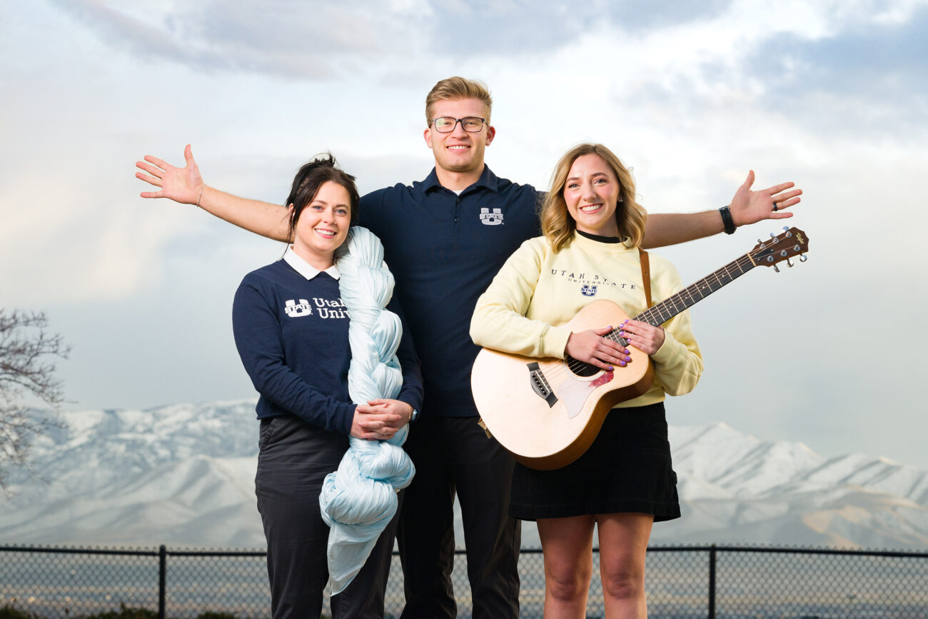 One USU alum stands with two USU students, all of which started their educational journey at USU's Logan Campus, but finished in USU's Statewide Campus system.