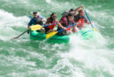 A group of five people navigate the rapids on the Alpine section of the Snake River.