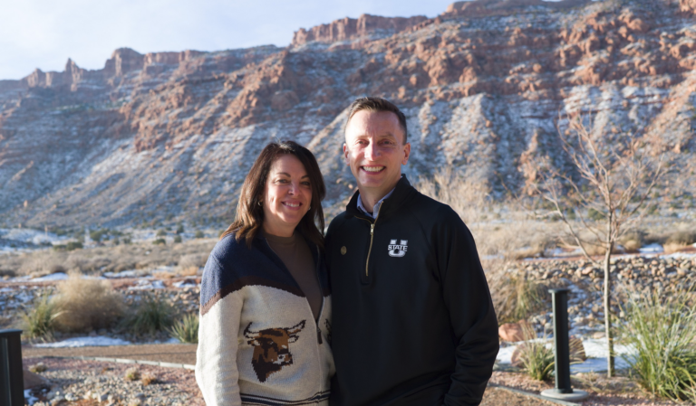 USU president Brad Mortensen and his wife Camille pose for a photo in Moab, Utah.